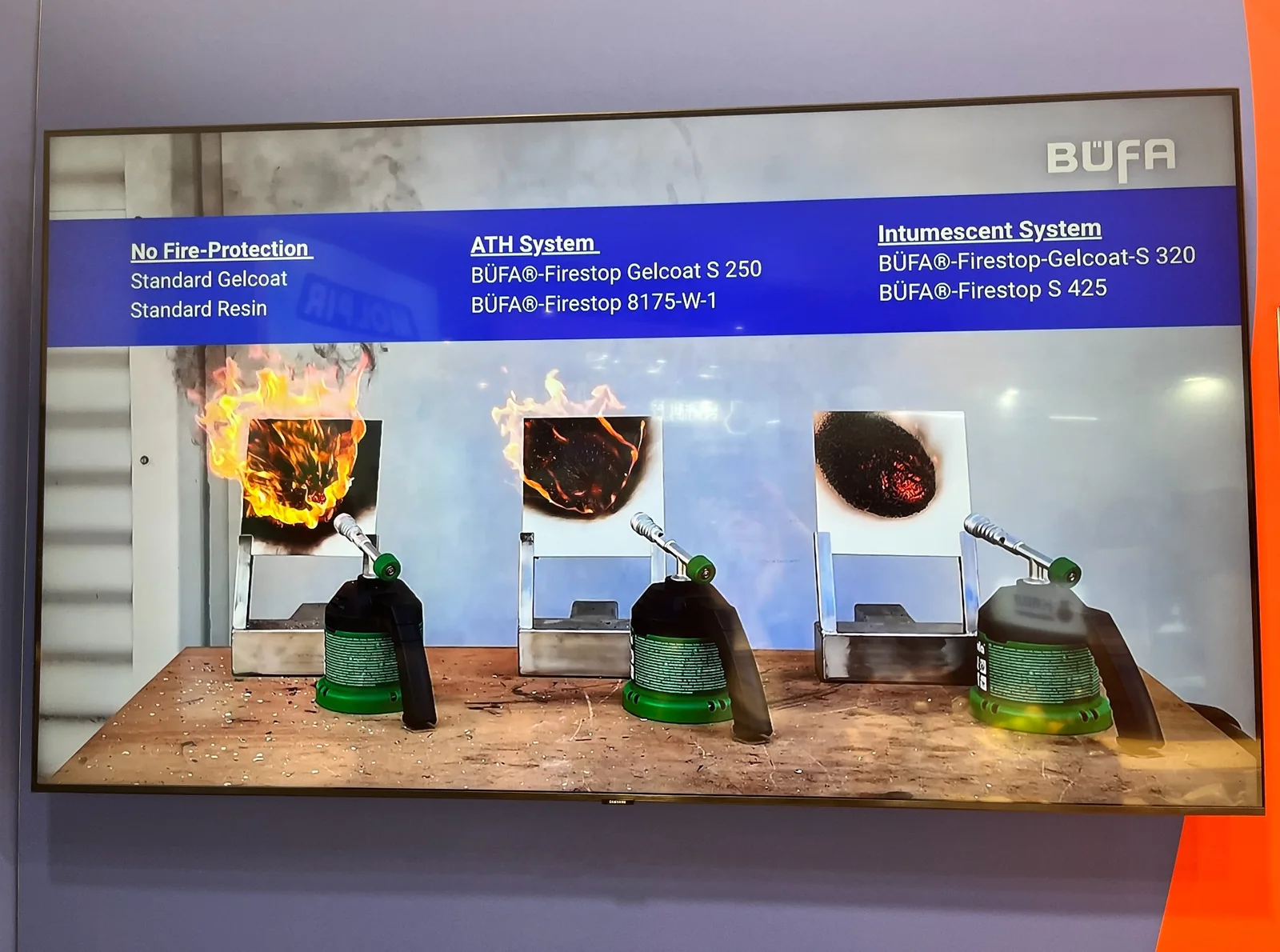 A display case presenting different fire retardant composite material systems and test specimens.