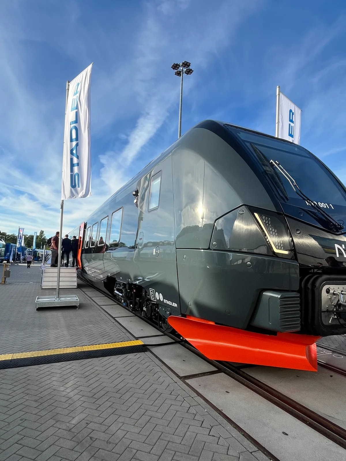 A modern rail vehicle exhibited on the outdoor tracks at InnoTrans 2026.